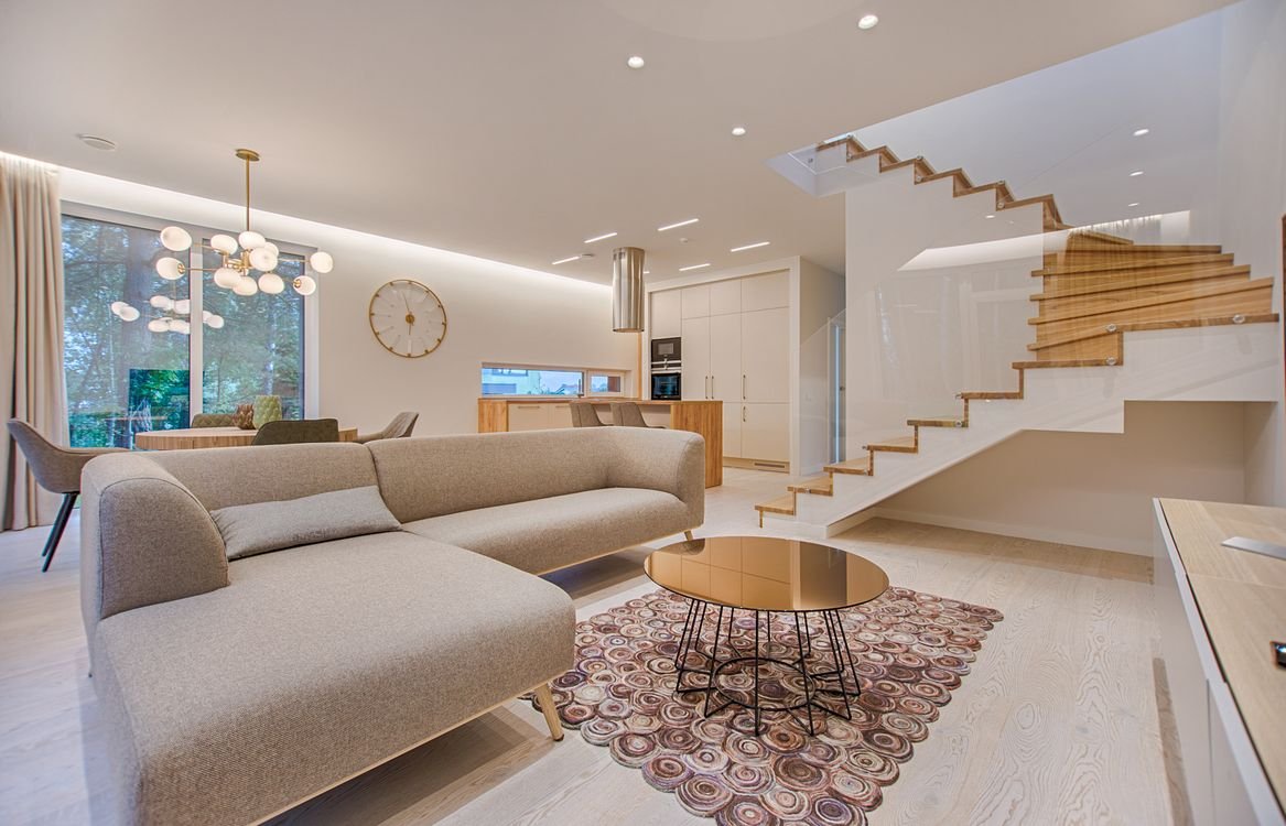 Modern living room with elegant home decor by PhaseNest